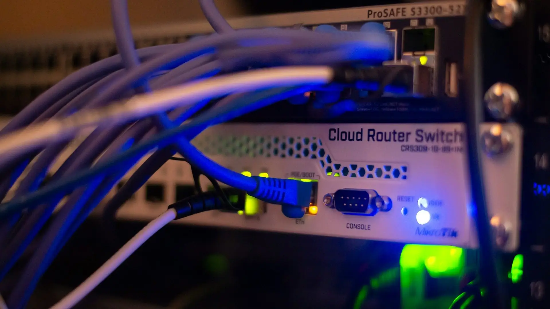 Blue network cables plugged into a switch